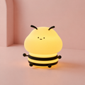 Veilleuse bébé Petite Abeille lumineuse sur fond rose clair